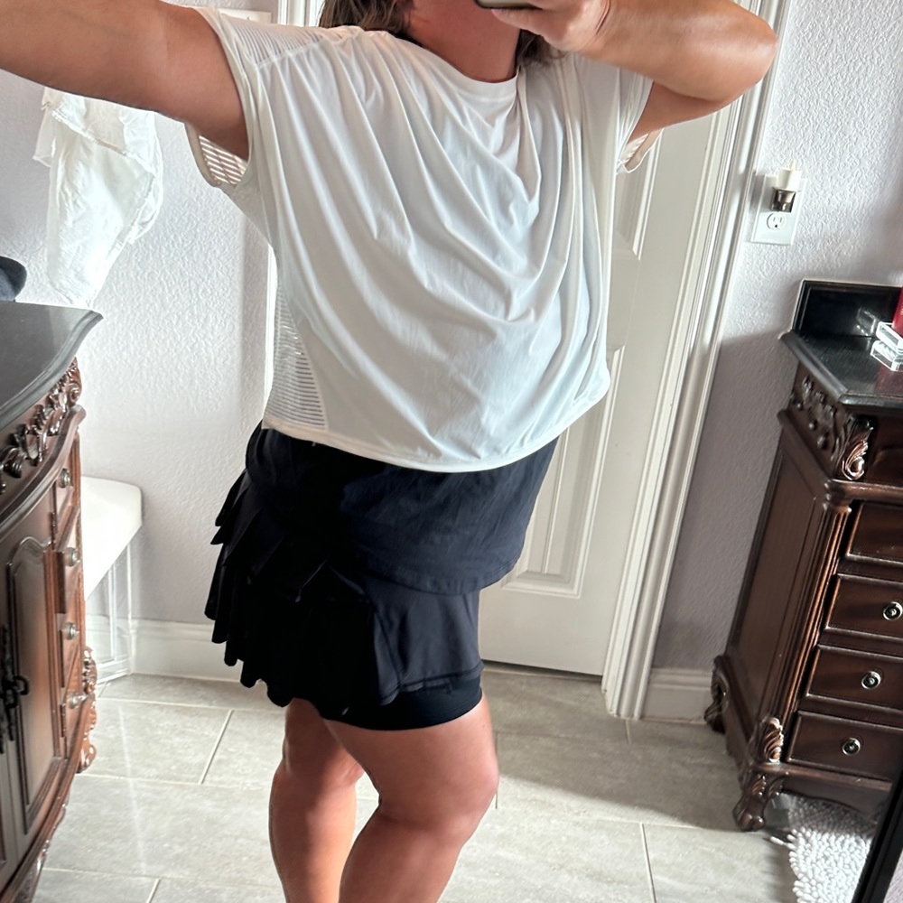 Lululemon Athletica Striped White Tee and Black Pleated Skirt